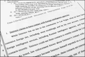  ?? JON ELSWICK / ASSOCIATED PRESS ?? The government’s memorandum in support of detention of Alexander Smirnov is photograph­ed on Wednesday.