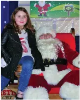  ??  ?? Olivia Shanahan meeting Santa Claus in his Killavulle­n grotto.