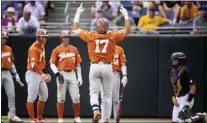  ?? MATT KELLEY — THE ASSOCIATED PRESS ?? Texas’ Ivan Melendez gestures at home plate after hitting a three-run home run against East Carolina on Sunday in Greenville, N.C.