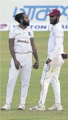  ?? (Photo: AFP) ?? West Indies’ Captain Kraigg Brathwaite (right) with his teammate Jomel Warrican during the fourth day of the second Test cricket match between West Indies and Bangladesh at the Sher-e-bangla National Cricket Stadium in Dhaka yesterday.