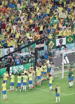  ?? (AFP) ?? Players of Brazil celebrate with the crowd after defeating Serbia 2-0 in their FIFA World Cup Qatar 2022 Group G match at the Lusail Stadium in Lusail on Thursday night.