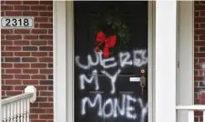  ?? AP ?? ‘POLITICS OF FEAR’: Graffiti reading, ‘Where’s my money’ is seen on a door of the home of Senate Majority Leader Mitch McConnell, in Louisville, Ky.