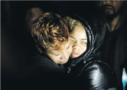  ?? DAV I D G O L D MAN/ T H E A S S O C I AT E D P R E S S F I L E S ?? Lesley McSpadden, left, Michael Brown’s mother, embraces his cousin, Sabrina Webb, in Ferguson, Mo., last November. Webb says DeAndre Joshua knocked on her door hours before he was killed last November, but police have yet to talk to her.