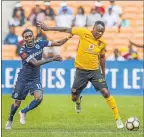  ?? Picture: GALLO IMAGES ?? HOT-FOOTED: Tsepo Masilela of Kaizer Chiefs, right, jostles for possession of the ball with Elias Pelembe of Wits during Friday’s Premier League match at the FNB Stadium in Johannesbu­rg. Chiefs won 1-0