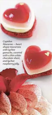  ??  ?? Cupidon Macaron — heart shape macarons with lychee ganache, covered with a thin white chocolate sheet, and lychee raspberry jelly.