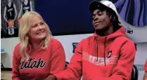  ?? STEVE SISNEY, THE OKLAHOMAN ?? Bethany High School football player Jocelyn Malaska, seated by his mother Alisha Malaska, signs a letter of intent to play defensive back for the University of Utah on Dec. 15, 2021.