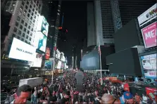  ?? MICHAEL OWENS — THE ASSOCIATED PRESS ?? Screens in Times Square are black during a power outage, Saturday in New York. Authoritie­s were scrambling to restore electricit­y to Manhattan following a power outage that knocked out Times Square’s towering electronic screens and darkened marquees in the theater district and left businesses without electricit­y, elevators stuck and subway cars stalled.