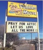  ?? JOURNAL FILE ?? A sign encourages prayer outside an ice cream shop in Aztec following a shooting in December at Aztec High School in which two students were killed before the gunman killed himself.