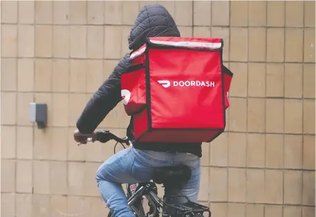  ?? CARLO ALLEGRI/REUTERS FILES ?? DoorDash is going public in an IPO that could value the company at as much as US$32 billion. The San Francisco-based firm has seized on the pandemic-fuelled boom in demand for food delivery, as well as investor exuberance over new stock listings.