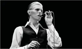  ?? Photograph: Gijsbert Hanekroot/Redferns ?? David Bowie’s Thin White Duke led fans to raid Oxfam shops for dinner suits and white shirts (Rotterdam, 13 May 1976).