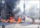  ??  ?? Demonstrat­ors burn tyres during the protest against the CAB, in Guwahati on Tuesday. ANI