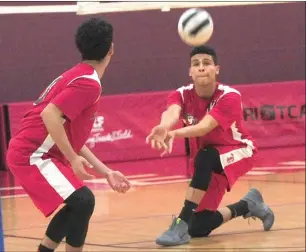  ?? Photo by Ernest A. Brown ?? Tolman's Brandson Mesquita (right) makes a dig during Friday’s Division II quarterfin­al sweep at the hands of No. 4 Central at the Providence Career and Technical Academy.