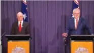 ?? SBS VIA AP ?? Australian Prime Minister Scott Morrison, right, with Australian Chief Medical Officer Paul Kelly, speak during a news conference in Canberra, Australia, on Thursday.