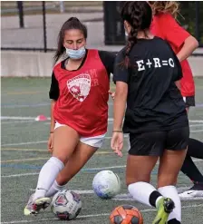  ??  ?? BACK AT IT: Olivia Sharkansky works with the ball as Hingham held tryouts for the varsity girls soccer team on Friday.