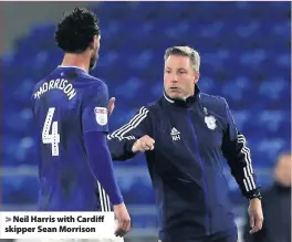  ??  ?? > Neil Harris with Cardiff skipper Sean Morrison