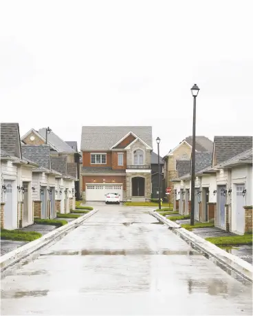  ?? COLE BURSTON/BLOOMBERG FILES ?? Low interest rates, a desire for more living space and a successful vaccine rollout were
identified as the potential drivers of Canadian housing market activity for 2021.