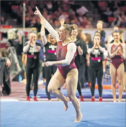  ?? [PHOTO COURTESY OU ATHLETICS] ?? Oklahoma's Brenna Dowell celebrates after completing a floor routine Sunday against UCLA at Lloyd Noble Center. Dowell and the No. 1-ranked Sooners trimmed the Bruins before a record 10,177 fans.