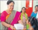  ??  ?? St. George’s School principal Dr Sara George distribute gifts to children.