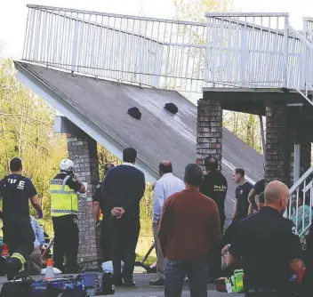  ?? SHANE MACKICHAN ?? Emergency crews work at the scene last April after the back deck of a Langley home collapsed during a wedding celebratio­n. Dozens of people were sent to hospital with a wide range of injuries.