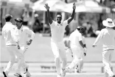  ??  ?? South African bowler Lungi Ngidi (C) celebrates the dismissal of Indian batsman Hardik Pandya (not in picture) during the fifth day of the second Test cricket match between South Africa and India at Supersport cricket ground on January 17, 2018 in...