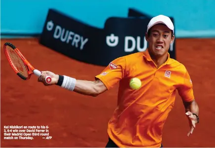  ?? — AFP ?? Kei Nishikori en route to his 63, 6-4 win over David Ferrer in their Madrid Open third round match on Thursday.