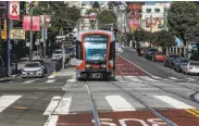  ?? Yalonda M. James / The Chronicle ?? Muni’s JChurch streetcar resumed service at the Balboa Park station in December, running between that station and Church and Duboce streets.