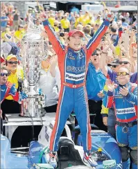  ?? AP PHOTO ?? Takuma Sato celebrates after winning the Indianapol­is 500 Sunday in Indianapol­is.