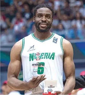  ??  ?? Ike Diogu during presentati­on as the Most Valuable Player of the championsh­ip…yesterday.
PHOTO: FIBA.BASKETBALL