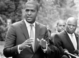  ?? AP ?? Bakari Sellers (left), the attorney for the families of victims killed in the 2015 Mother Emanuel AME Church massacre, speaks with reporters outside the Justice Department, in Washington, yesterday.