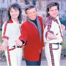  ??  ?? Top of the pops: DJ Tony Blackburn with Bay City Rollers Ian Mitchell and Les Mckeown, and (right) a younger Ian Mitchell