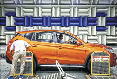  ?? SHEN QILAI / BLOOMBERG ?? A vehicle sits in an acoustics testing laboratory at BYD’s headquarte­rs in Shenzhen, Guangdong province. The nation’s leading maker of electric cars is to consider supplying its batteries to competitor­s.