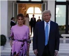 ?? — AFP photo ?? Trump and Melania arrive at the home of billionair­e investor John Paulson in Palm Beach, Florida.