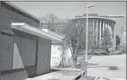  ?? File photo/NWA Democrat-Gazette/DAVID GOTTSCHALK ?? The Old City Hospital and the Fayettevil­le Public Library are seen March 5. An event will be held Tuesday to kick off the library’s expansion project.