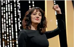  ??  ?? Actress Asia Argento gives a clenched-fist salute on stage during the closing ceremony of the 71st internatio­nal film festival, Cannes at southern France.