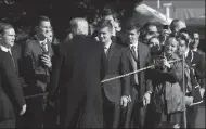  ?? OLIVIER DOULIERY/ABACA PRESS ?? President Donald Trump greets guests before boarding Marine One on Thursday in Washington, D.C. President Trump was traveling to Montana, and Arizona for campaign rallies.