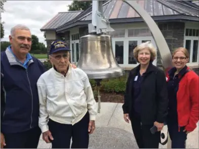  ?? PAUL POST — PPOST@DIGITALFIR­STMEDIA.COM ?? World War II Navy veteran Armand Jolly, second from left, honored fallen shipmates of the USS Emmons during ceremonies Friday at Saratoga National Cemetery. Jolly is joined, left to right, by his son, Dennis; daughter-in-law, Donna Jolly; and granddaugh­ter Jessica Ciparelli.