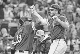  ?? PETER AIKEN USA TODAY Sports ?? Kansas City Royals first baseman Vinnie Pasquantin­o (9) celebrates with catcher Salvador Perez (13) after hitting a solo home run in the fourth inning against the Baltimore Orioles at Kauffman Stadium on April 19, 2024.