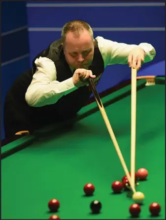  ??  ?? No rest for the wicked...John Higgins resumes play against Martin Gould this morning