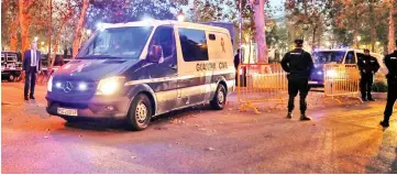  ??  ?? Police vans carrying members of the dismissed Catalan cabinet leave a garage of Spain’s High Court after a Spanish judge ordered the former Catalan leaders to be remanded in custody pending an investigat­ion into Catalonia’s independen­ce push, in...