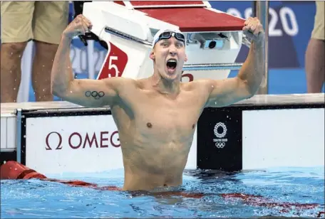  ?? Photograph­s by Robert Gauthier Los Angeles Times ?? CHASE KALISZ goes into flex mode after winning the first U.S. gold medal of the Tokyo Olympics. Kalisz, who finished second at the 2016 Rio Olympics, touched first in 4 minutes 9.42 seconds to win the 400-meter individual medley. “It’s my lifelong dream,” he says of the win.