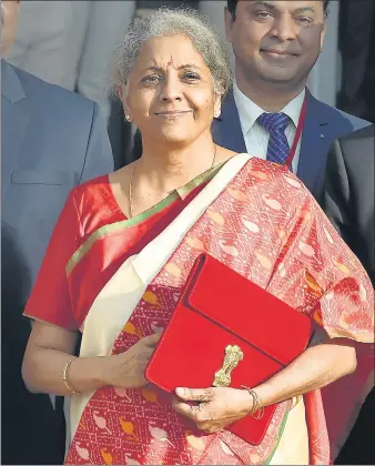  ?? AJAY AGGARWAL /HT PHOTO ?? Finance minister Nirmala Sitharaman with officials before presenting the Union Budget in New Delhi on Monday.