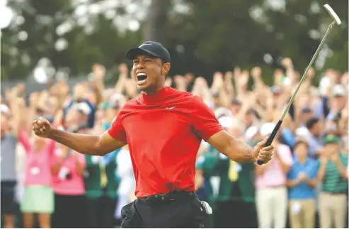  ?? ANdreW redINGTON / GeTTy IMAGeS FILeS ?? In a rare moment of recent triumph, golf legend Tiger Woods celebrates after sinking his putt to win the 2019 Masters.