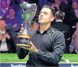  ?? Picture: PA. ?? Ronnie O’Sullivan lifts the UK championsh­ip title for a record-breaking seventh time after his 10-6 win over Mark Allen.