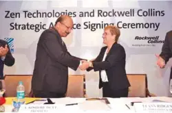  ??  ?? A. Kishore Dutt, President of Zen Technologi­es, and LeAnn Ridgeway,
Vice President of Rockwell Collins, signing the MoU