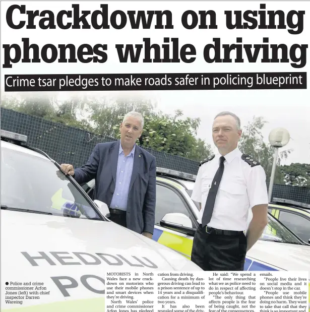  ??  ?? ● Police and crime commission­er Arfon Jones (left) with chief inspector Darren Wareing