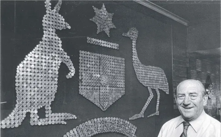  ??  ?? Legendary Belmont Hotel publican Cliff Splatt proudly shows off his Australian coat of arms made up of copper coins in 1983.