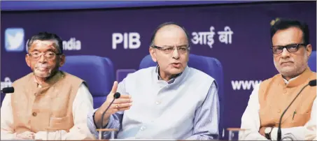  ?? PTI ?? Union finance minister Arun Jaitley (centre) with minister of state for finance Santosh Kumar Gangwar (left) and revenue secretary Hasmukh Adhia at a press conference on GST in New Delhi on August 4