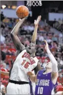  ?? JOHN LOCHER/ LAS VEGAS REVIEW-JOURNAL FILE PHOTO ?? Anthony Bennett (15), scoring on a putback against Air Force’s Todd Fletcher last season, is favorably compared to Larry Johnson.