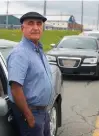  ?? RYAN TAPLIN • THE CHRONICLE HERALD ?? Darshan Virk, president of the United Cab Drivers Associatio­n of Halifax, poses for a photo with his cab at the Halifax Stanfield Airport on Tuesday. Virk says it’s been a difficult time for cab drivers during the pandemic and is hoping that the return of internatio­nal travelers to the airport will help his industry.