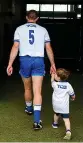  ??  ?? Exit: Walsh with his son, Tadhg